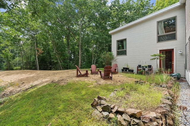 view of yard with an outdoor fire pit