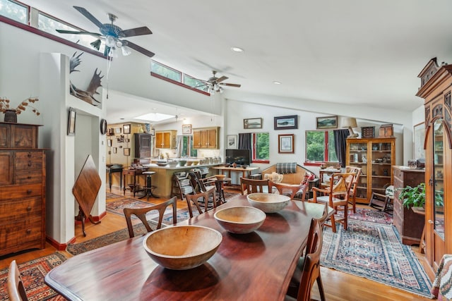 dining room with light wood-style flooring, a ceiling fan, lofted ceiling, and recessed lighting