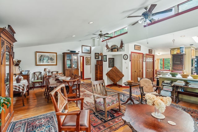 living area featuring light wood-style floors, ceiling fan, vaulted ceiling, and recessed lighting