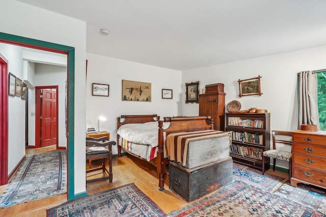 bedroom with wood finished floors
