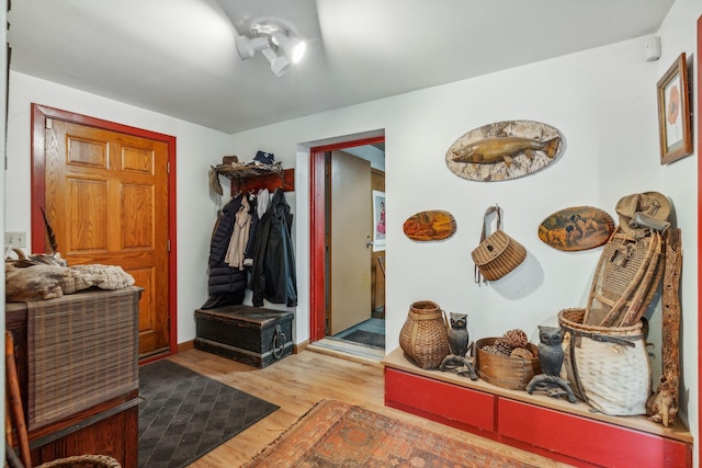 mudroom with wood finished floors