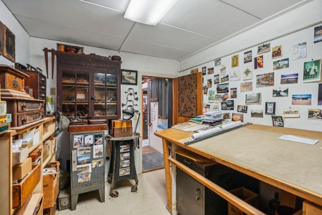 home office featuring concrete floors
