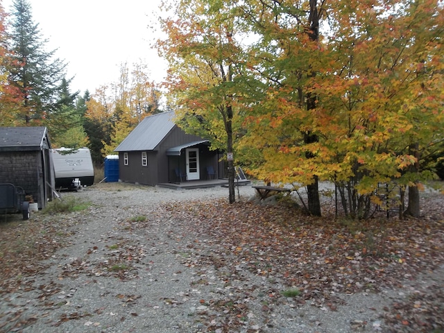 view of side of home with an outdoor structure