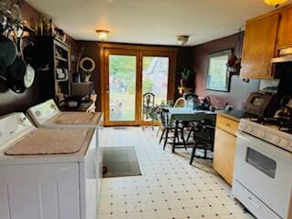 kitchen featuring separate washer and dryer and gas range gas stove