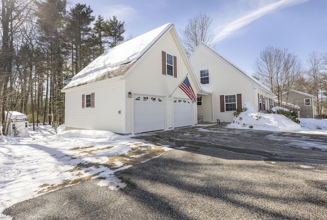 view of front of property featuring driveway and an attached garage