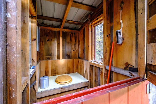 misc room featuring wood walls