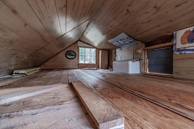 bonus room with wood walls, wooden ceiling, and vaulted ceiling