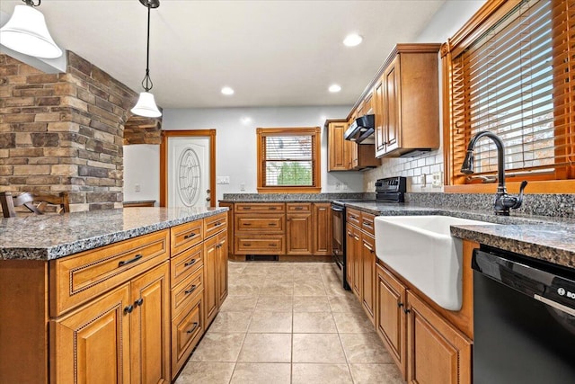 kitchen featuring hanging light fixtures, backsplash, ventilation hood, black appliances, and light tile patterned floors