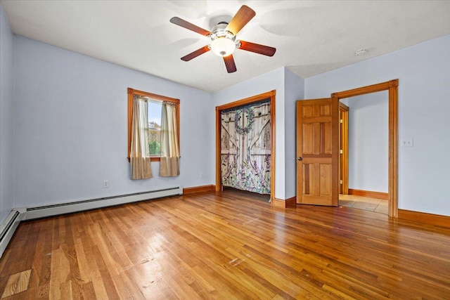 unfurnished bedroom featuring wood-type flooring and ceiling fan