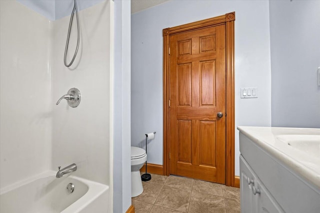 full bathroom featuring vanity, toilet, tile patterned floors, and bathing tub / shower combination