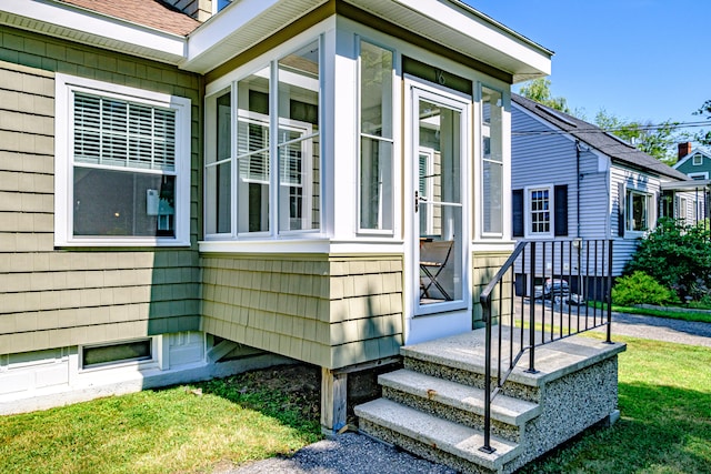 view of property exterior with a yard