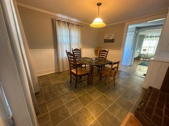 dining room featuring crown molding