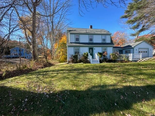 rear view of house with a lawn