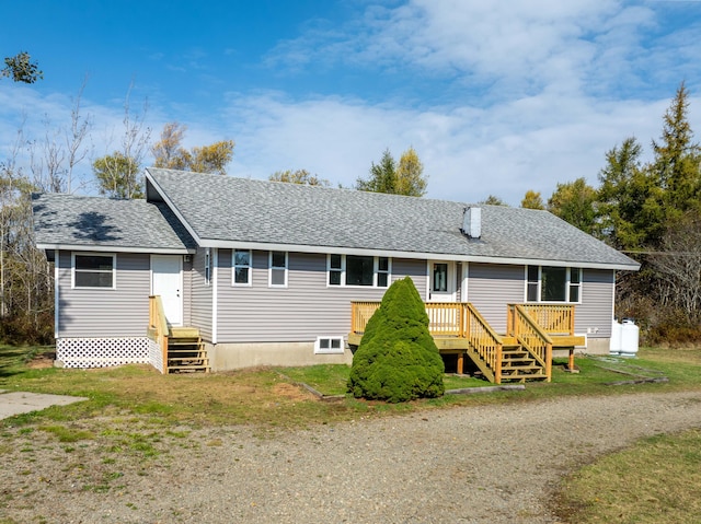 954 Mason Bay Rd, Jonesport, ME 04649 - ranch-style house with a wooden deck, roof with shingles, and a front yard