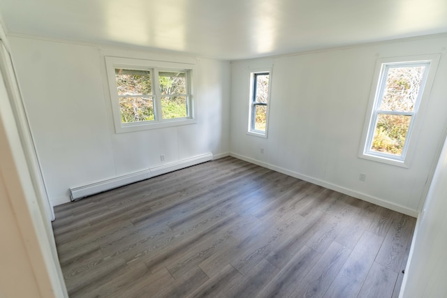 954 Mason Bay Rd, Jonesport, ME 04649 - unfurnished room with a baseboard radiator and wood finished floors