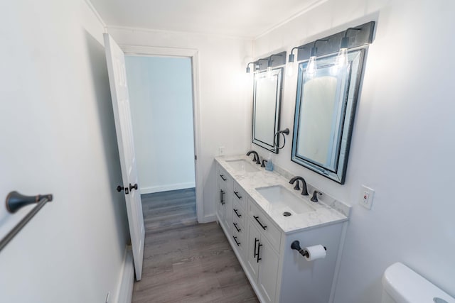 954 Mason Bay Rd, Jonesport, ME 04649 - bathroom featuring double vanity and wood finished floors