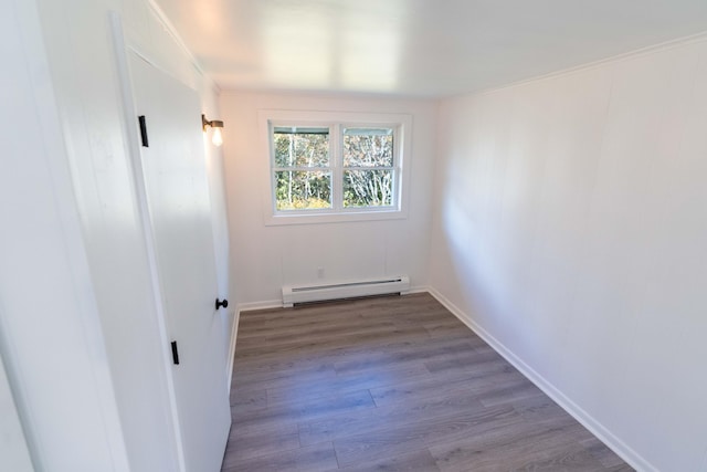 954 Mason Bay Rd, Jonesport, ME 04649 - unfurnished room with a baseboard radiator and wood finished floors