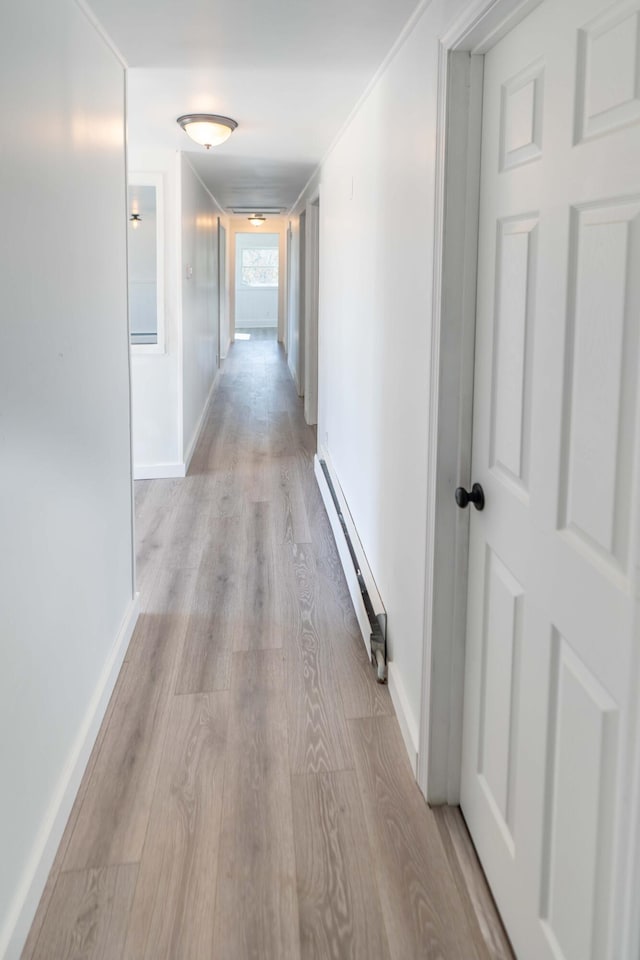 954 Mason Bay Rd, Jonesport, ME 04649 - corridor featuring baseboard heating and light wood-type flooring