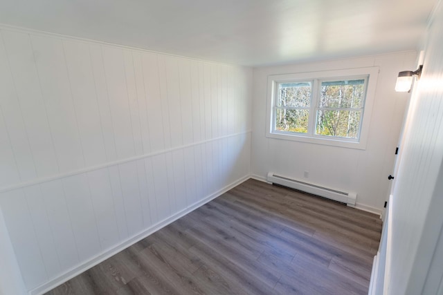 954 Mason Bay Rd, Jonesport, ME 04649 - empty room featuring a baseboard radiator and dark wood-type flooring