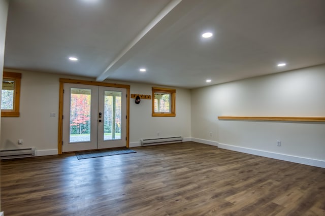 interior space with beam ceiling, a baseboard heating unit, dark wood-type flooring, and french doors