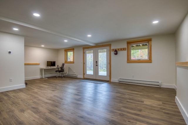 interior space featuring dark wood-type flooring, baseboard heating, and french doors