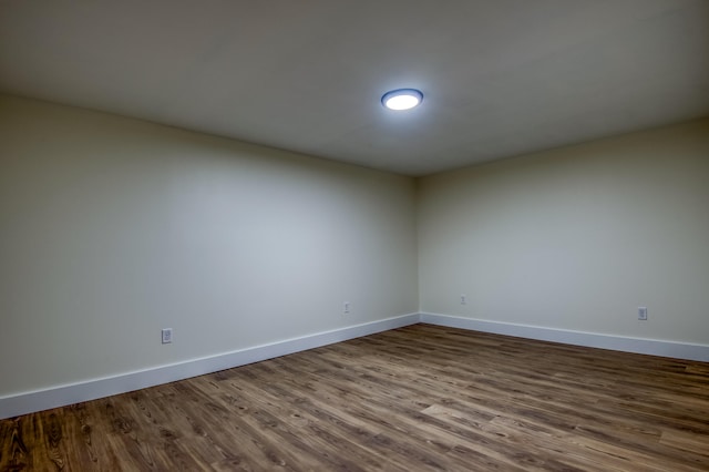 spare room with hardwood / wood-style floors