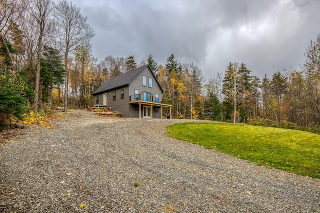 view of property exterior with a lawn