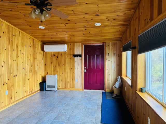 376 Fort Fairfield Rd, Caribou, ME 04736 - entryway featuring a wall mounted AC, wood ceiling, wooden walls, and ceiling fan