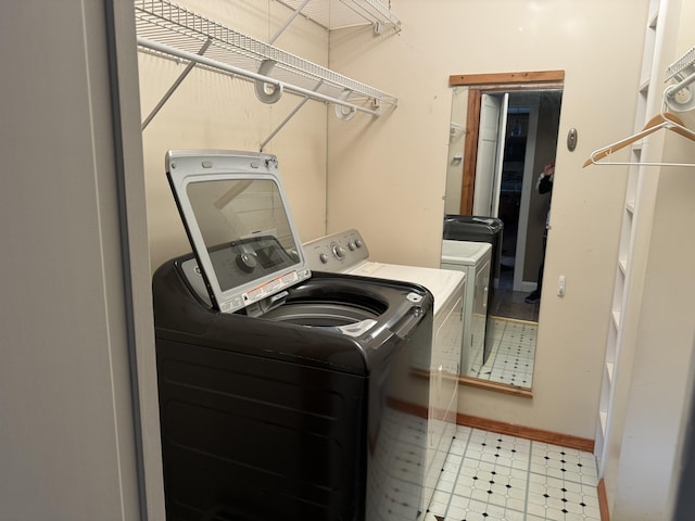 376 Fort Fairfield Rd, Caribou, ME 04736 - laundry room with washing machine and dryer and baseboards