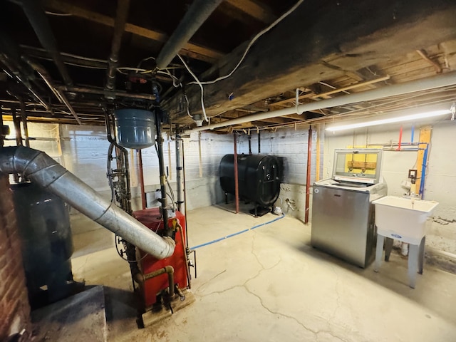 376 Fort Fairfield Rd, Caribou, ME 04736 - unfinished basement featuring oil tank and washer / clothes dryer