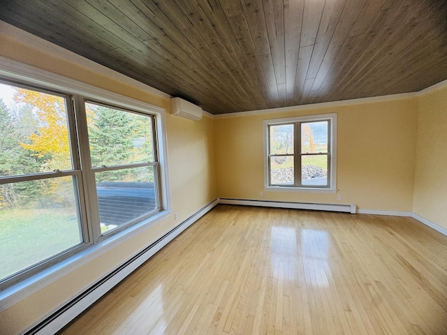 376 Fort Fairfield Rd, Caribou, ME 04736 - spare room with baseboard heating, a baseboard heating unit, crown molding, light wood finished floors, and wood ceiling