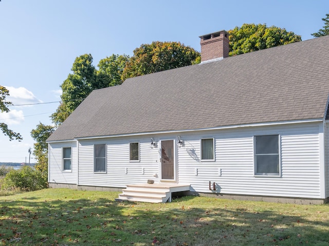 back of house with a yard