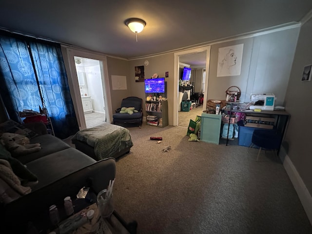 interior space with carpet flooring, ornamental molding, and ensuite bath