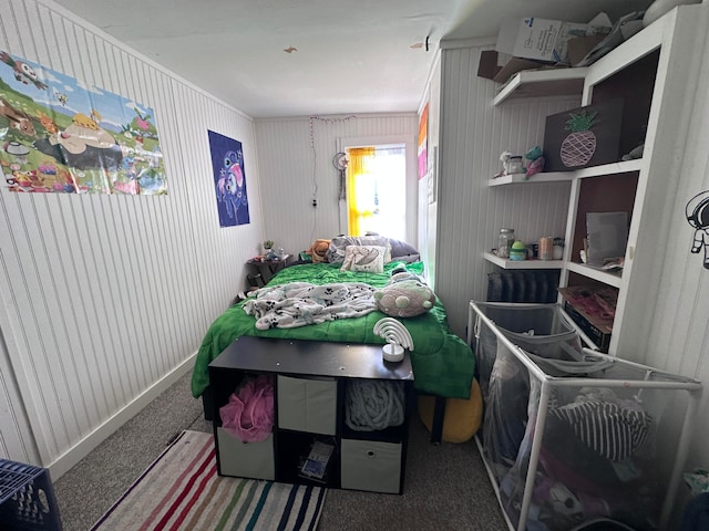 bedroom featuring crown molding and carpet floors