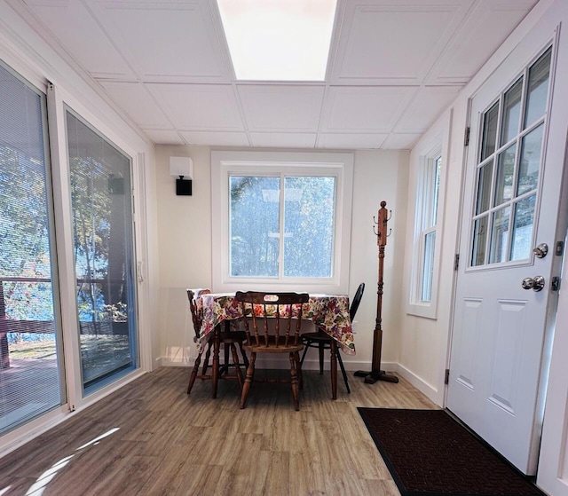 dining area featuring baseboards and wood finished floors