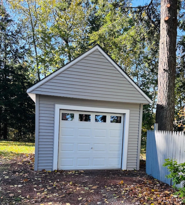 garage with fence