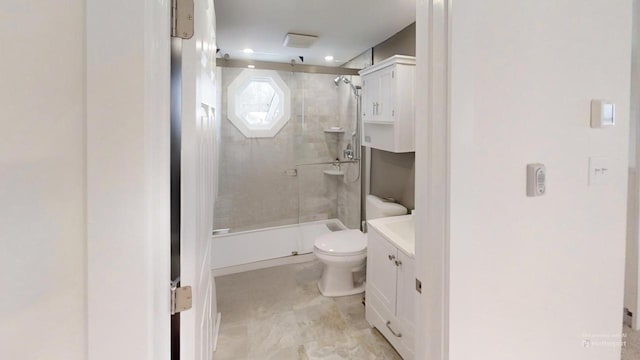 full bathroom featuring toilet, a shower stall, and vanity