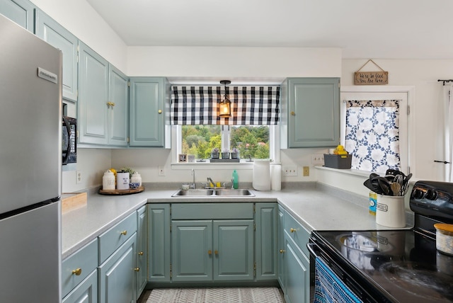 kitchen with black appliances and sink