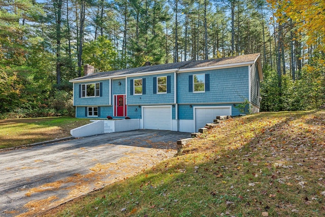 raised ranch featuring a garage