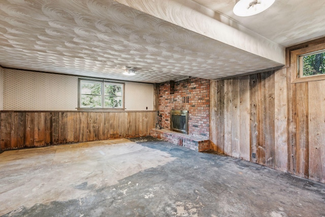 basement featuring a brick fireplace