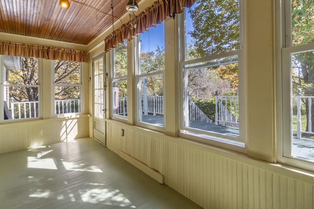 unfurnished sunroom featuring a wealth of natural light