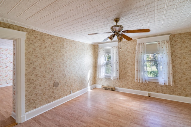 empty room featuring ceiling fan and light hardwood / wood-style floors