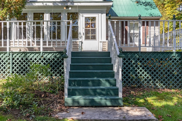 rear view of property featuring a deck