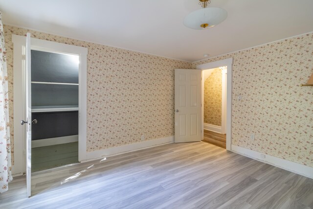 unfurnished bedroom featuring light wood-type flooring