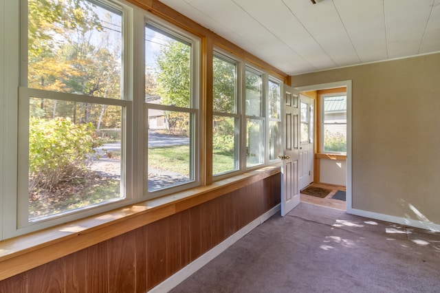 unfurnished sunroom with plenty of natural light