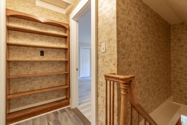 stairs with wood-type flooring