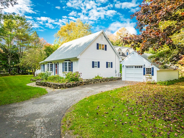 view of property exterior with a garage and a yard