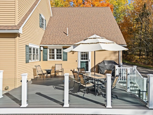 wooden deck with grilling area