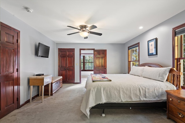 carpeted bedroom with ceiling fan