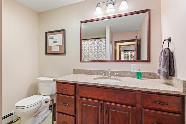 bathroom with baseboard heating, vanity, and toilet